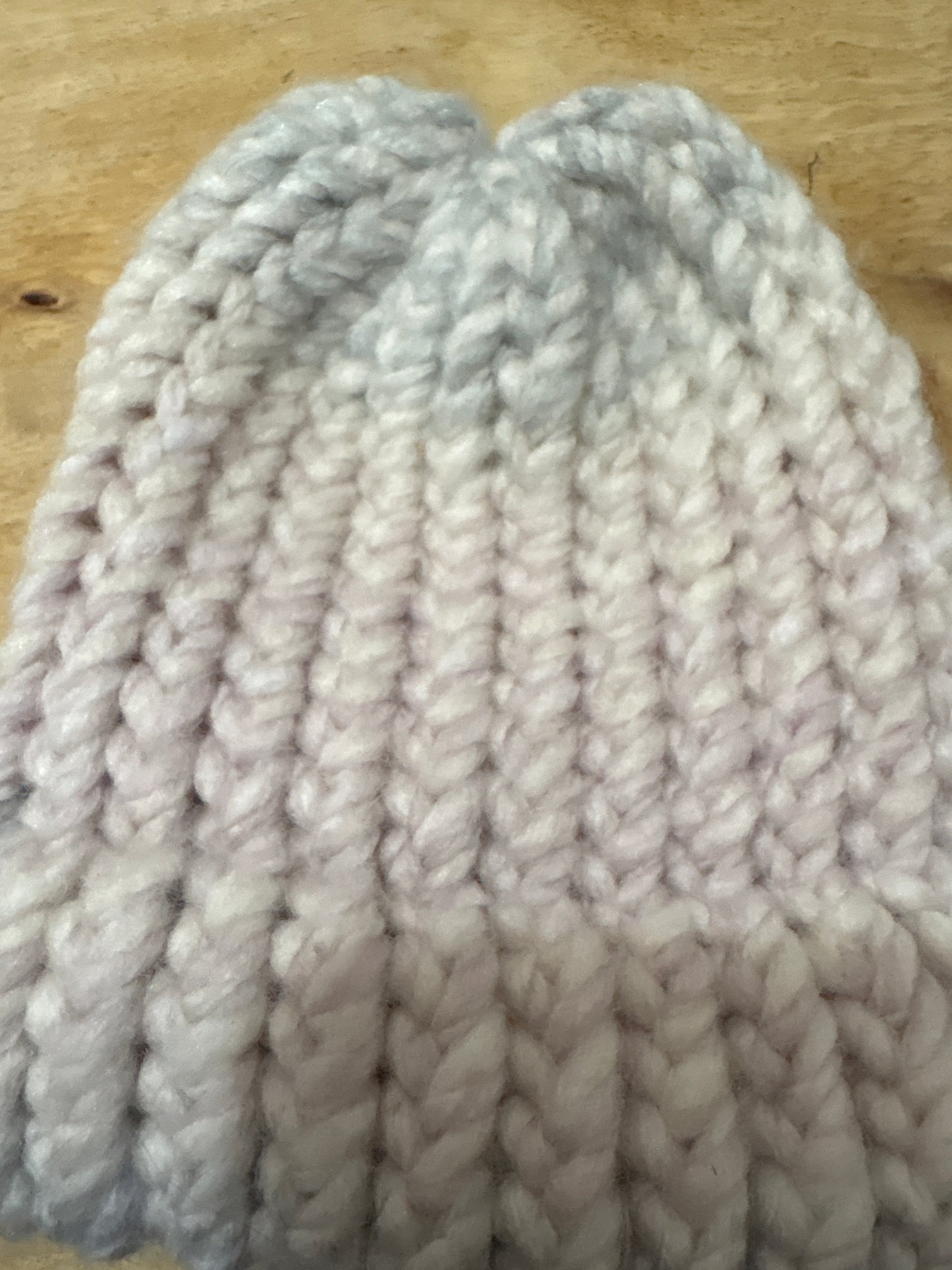 Muted pink and blue fuzzy baby hat
