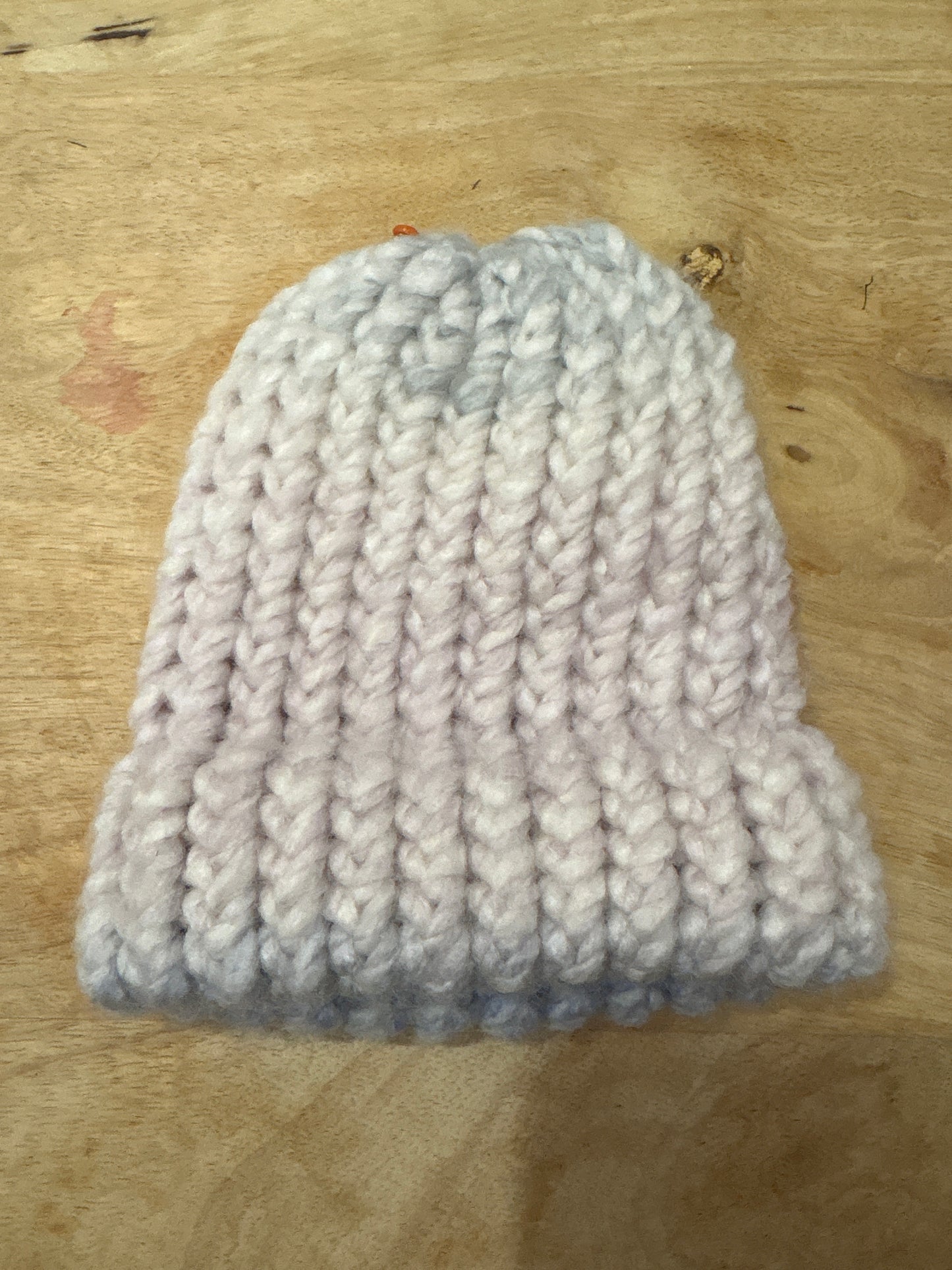 Muted pink and blue fuzzy baby hat