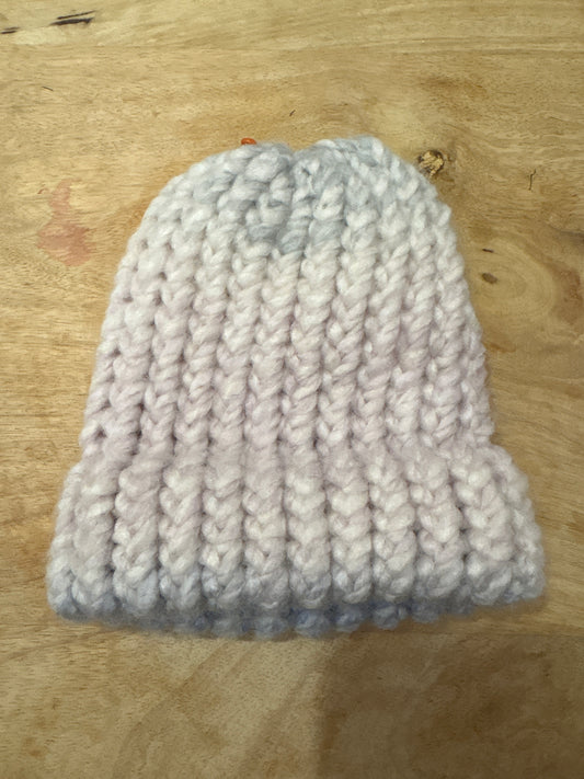 Muted pink and blue fuzzy baby hat